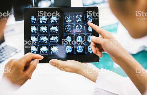 Doctor and patient using digital tablet